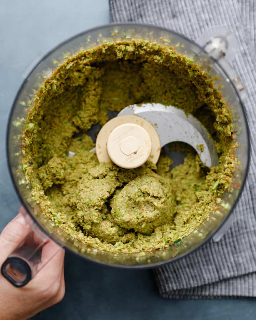 overhead shot of a food processor with an edamame and chia seed mixture