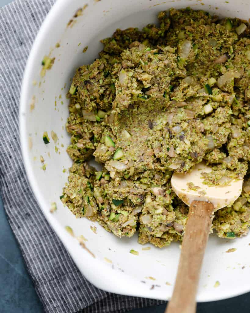 Overhead shot of a bowl filled with the mixture to make edamame mushroom veggie burgers.