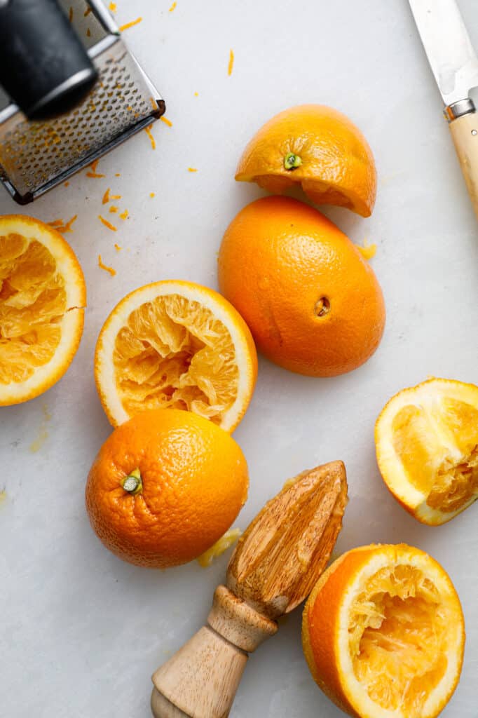 overhead shot of oranges with a grater to be added to the recipe