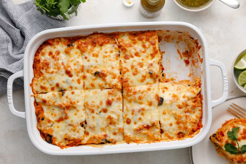 a casserole dish with a slice of the Southwest Chicken and Rice removed