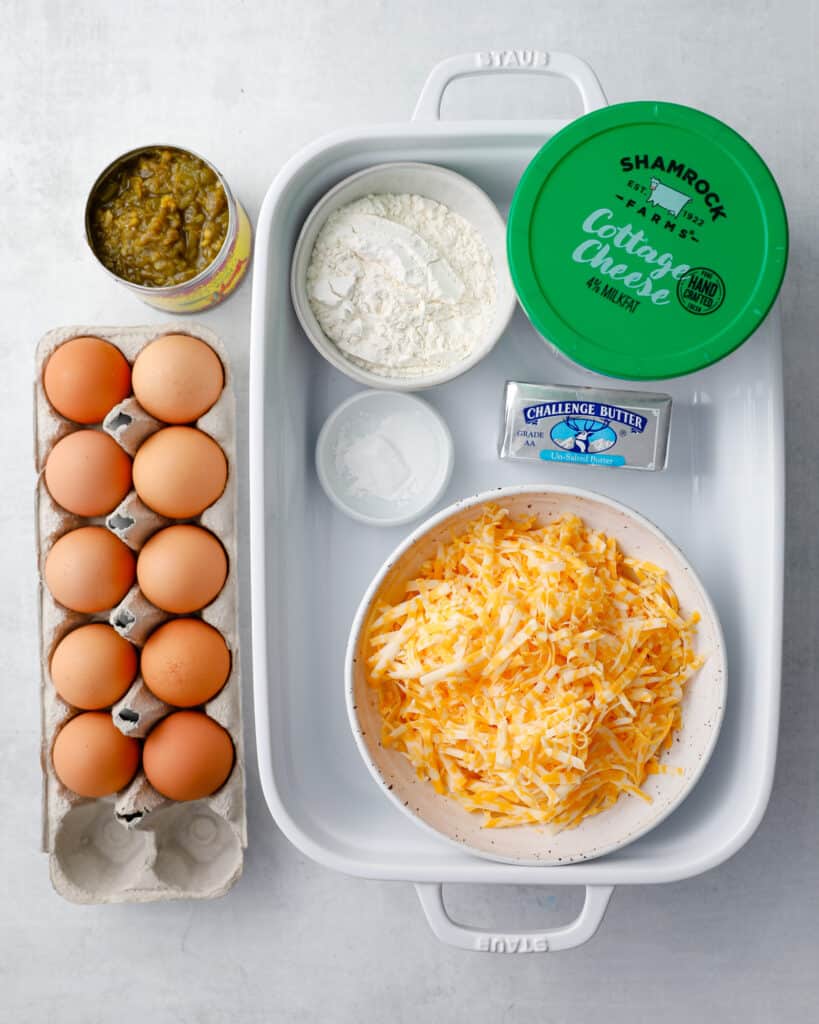 the ingredients to make green chili egg casserole - an easy overnight breakfast casserole - eggs, green chilis, flour, baking powder, butter, cottage cheese, colby jack or cheddar cheese