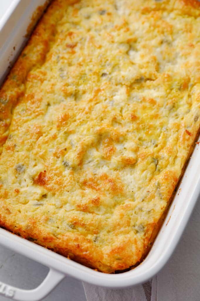 A pan fresh out of the oven filled with easy overnight breakfast egg casserole with green chilis - viewed on a close up angle