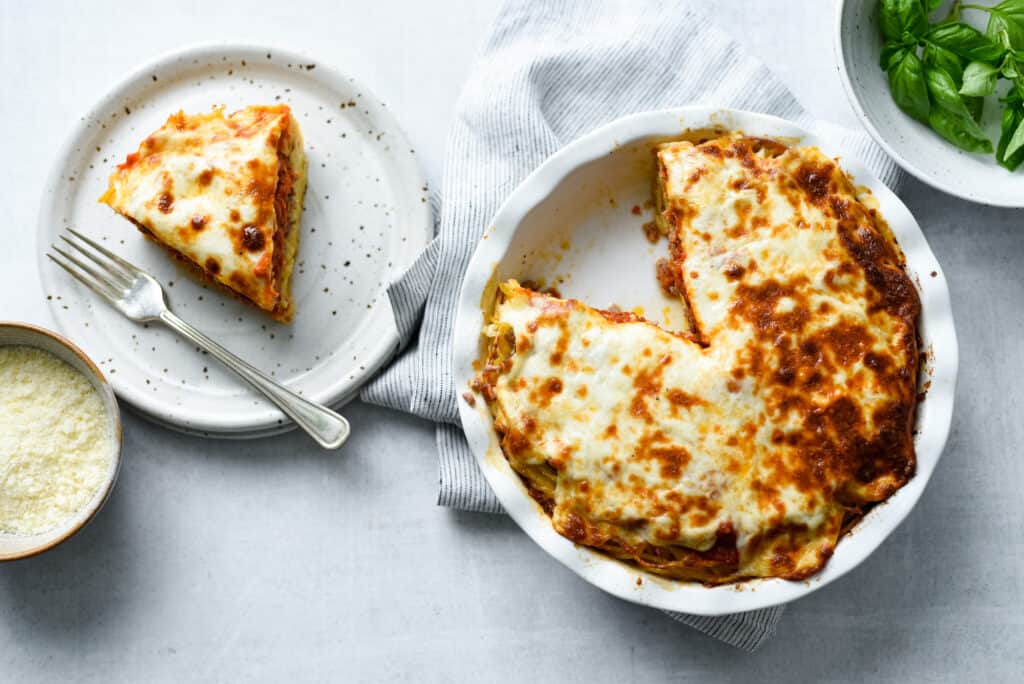 baked spaghetti pie straight from the oven with melty browned cheese on top