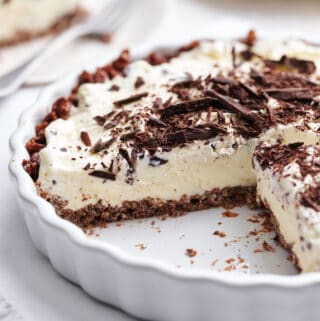 ice cream pie in a pie dish with a slice removed
