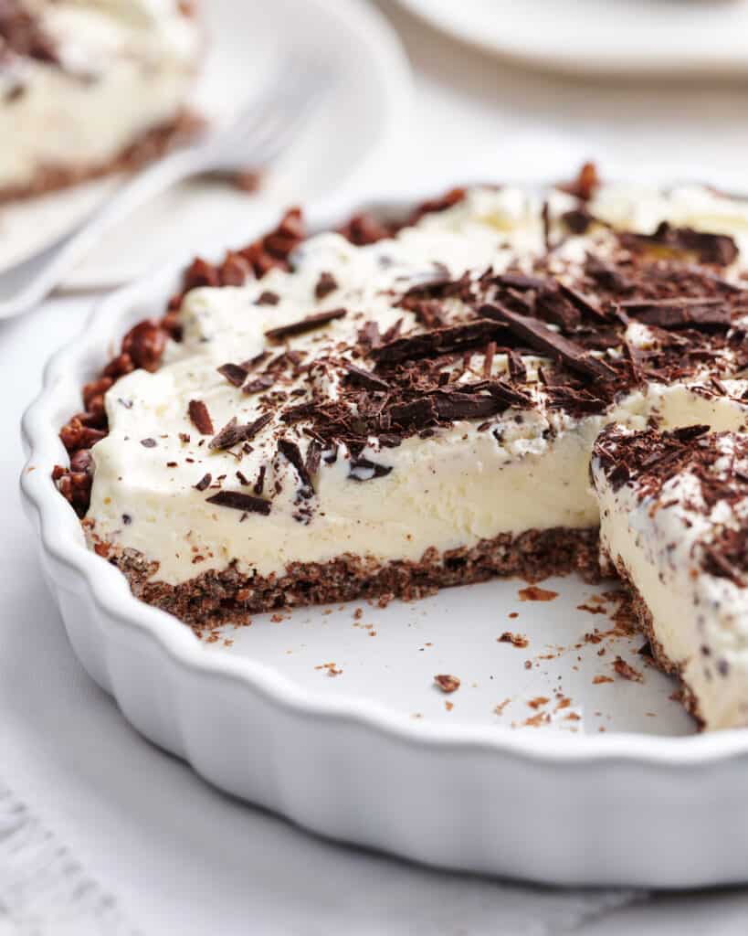 ice cream pie in a pie dish with a slice removed