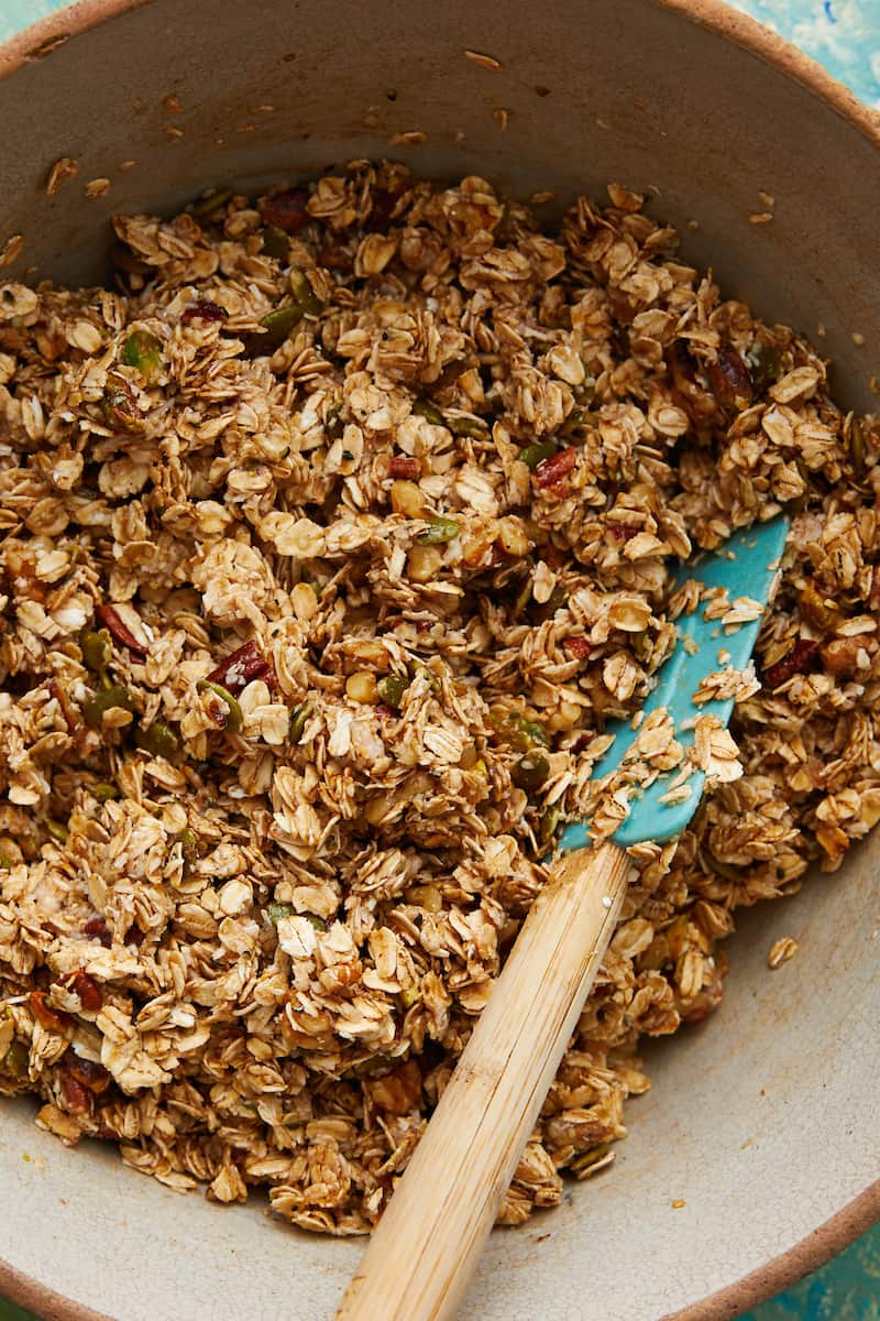 in process image of mixing granola before it's baked