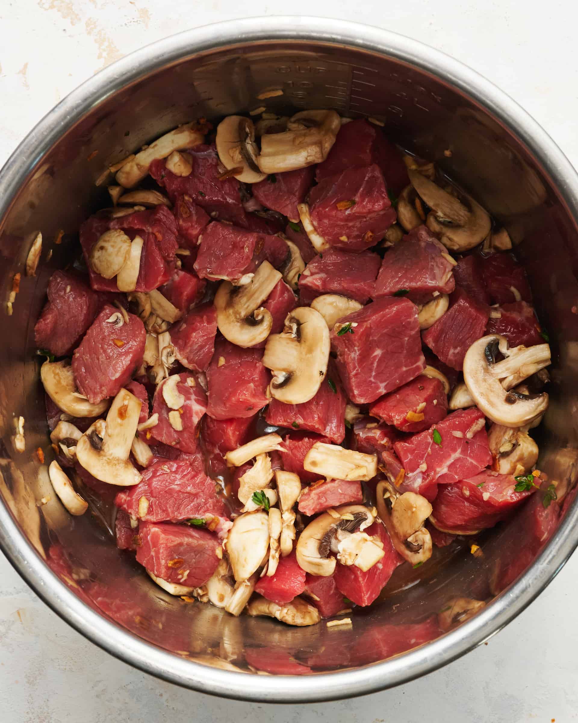 Ingredients for beef tips in the pot before being cooked