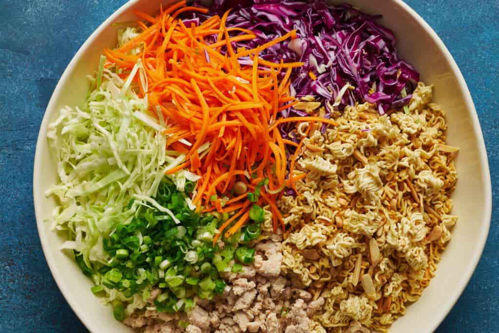 overhead view of a bowl of salad ready to be mixed