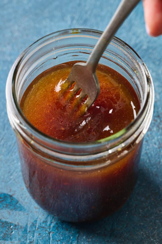 salad dressing with soy, rice wine vinegar, ginger, sesame oil and honey in a jar