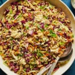 overhead view of a bowl of chicken salad with an Asian dressing, ramen noodles and cabbage