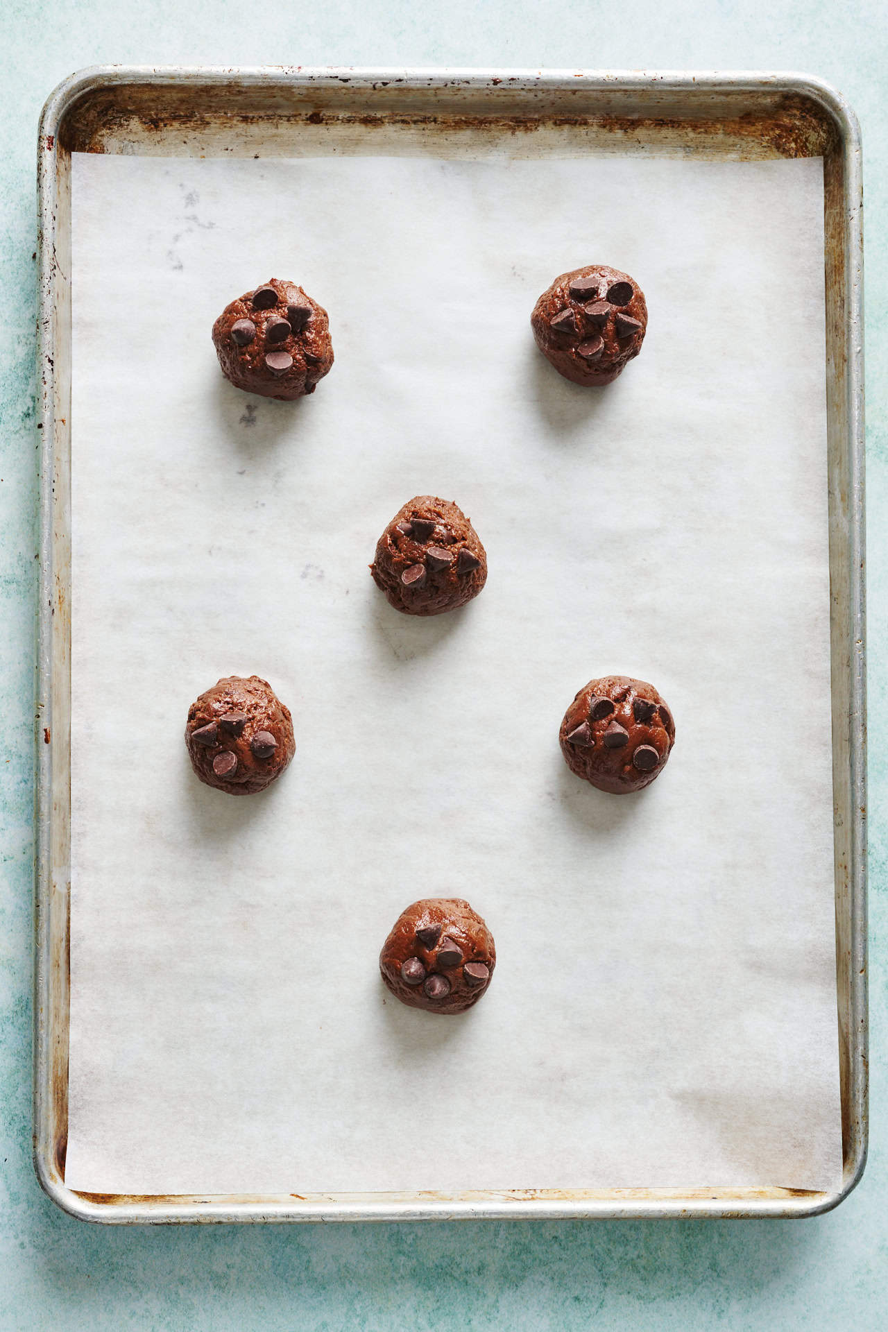 dough balls on a cookie sheet