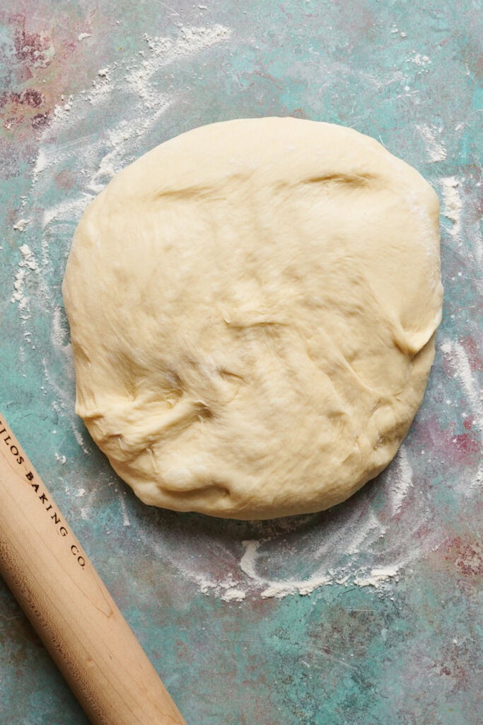 Risen dough on a floured work surface