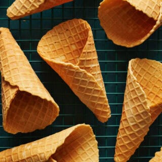 Overhead view of waffle cones cooling on a rack
