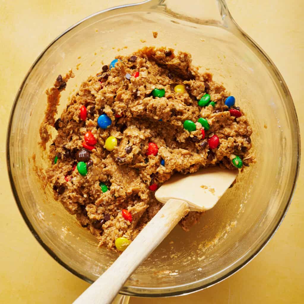 overhead view of monster cookie dough in a mixing bowl