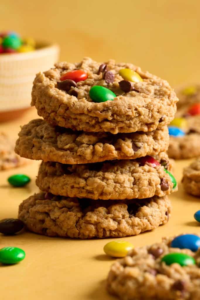 Side view of a stack of gluten free flourless monster cookies