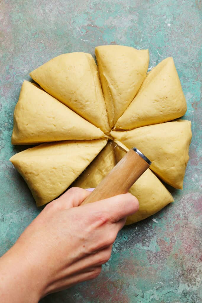 doing being portioned into 8 smaller dough balls