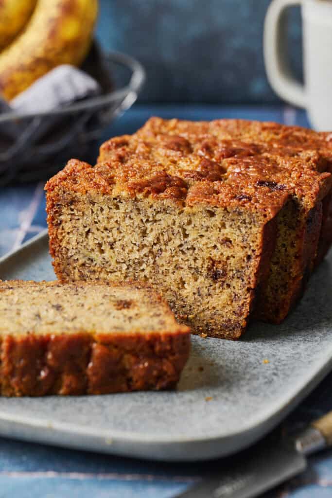 sourdough banana bread loaf on a plate, sliced