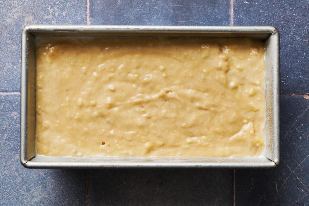 sourdough banana bread batter in a pan