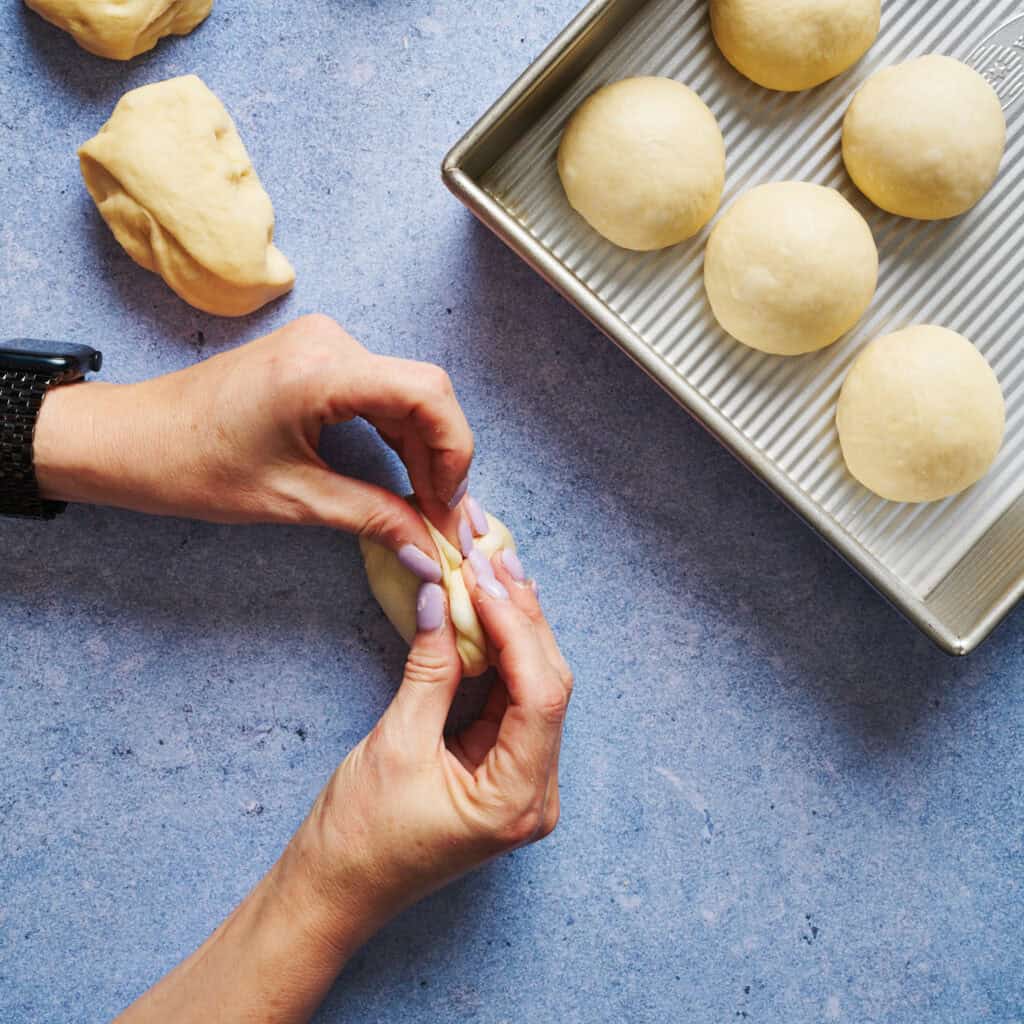 pinching up sides of dough ball