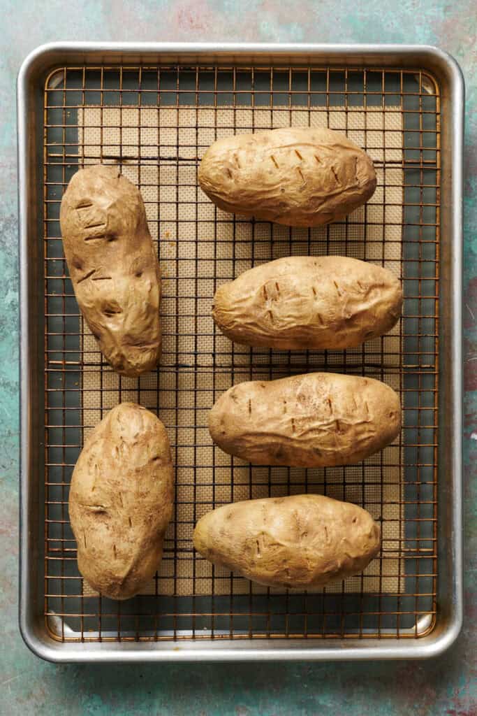 baked potatoes on a wire rack out of the oven