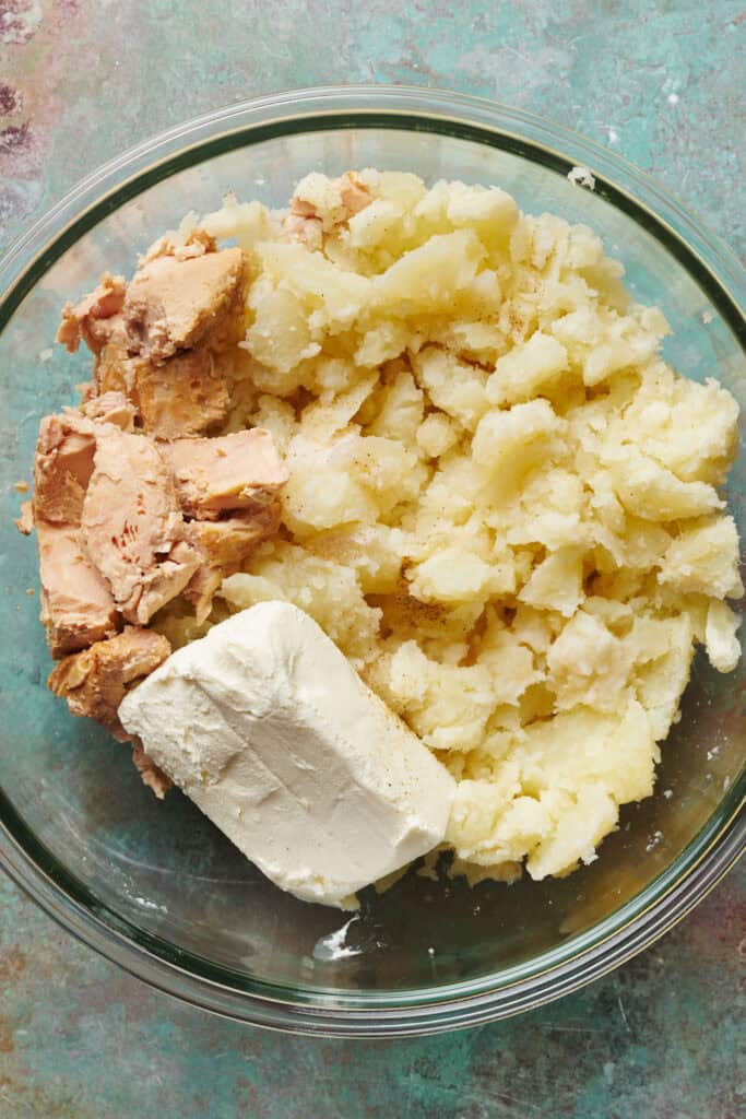 potato, cream cheese, tuna and celery salt in a bowl