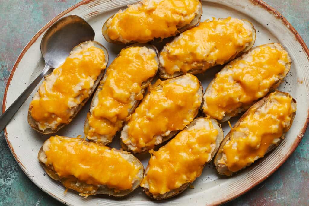 A platter filled with Tuna Baked Potatoes