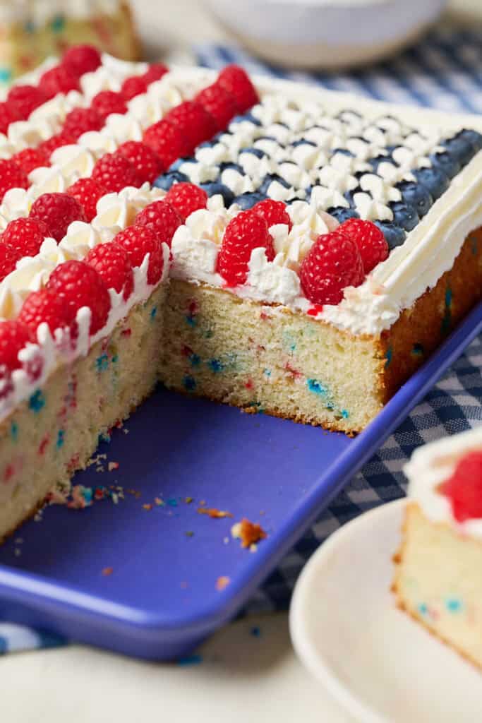 Side view of cake with slices missing to show the funfetti interior