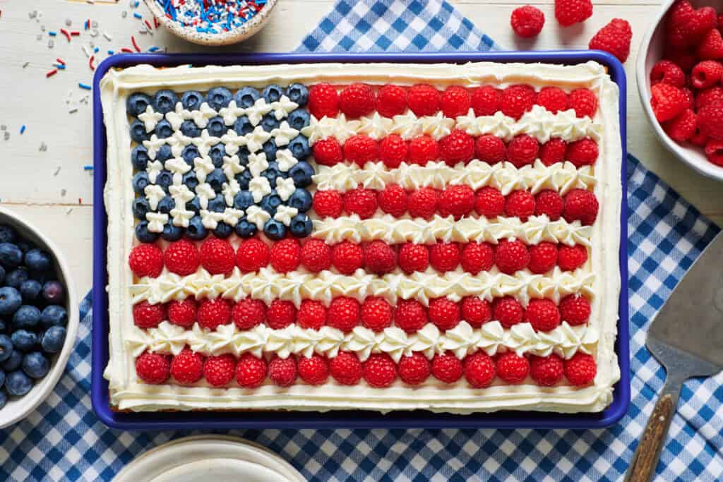 Overhead view of a sheet cake decorated to look like the American flag