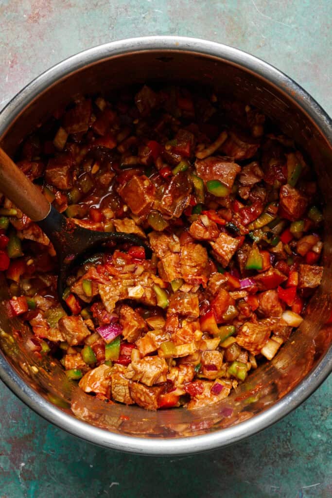 steak chili mixed up and in the pot ready to slow cook