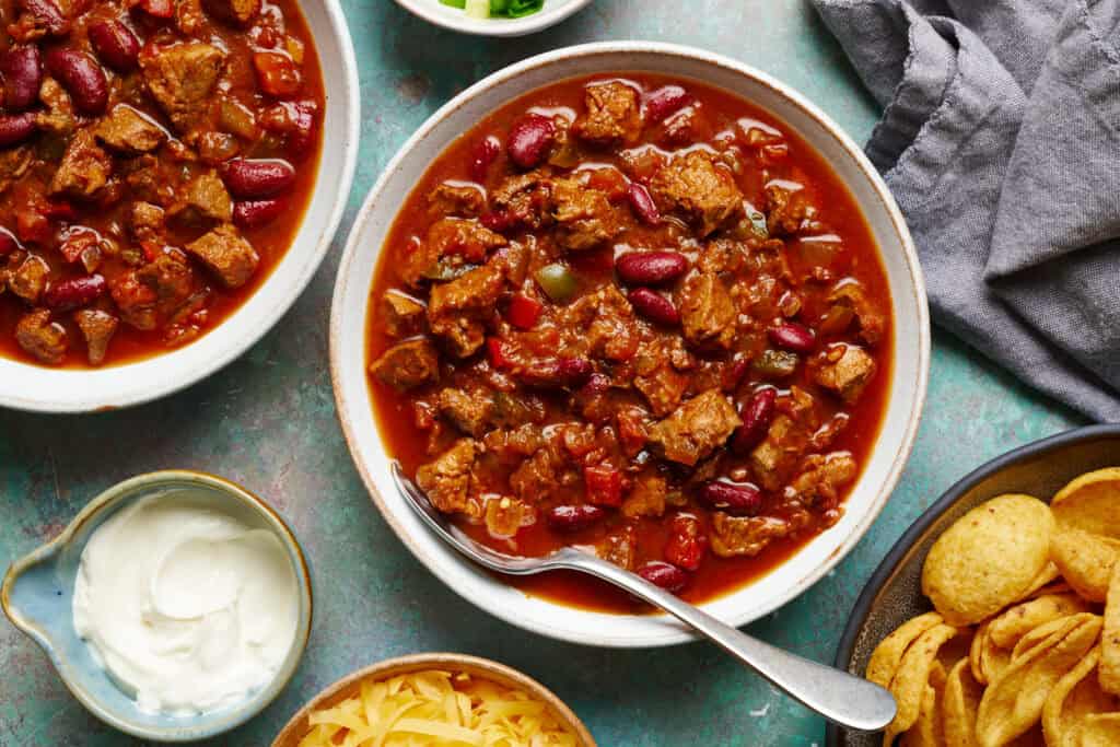chili in a bowl with a spoon