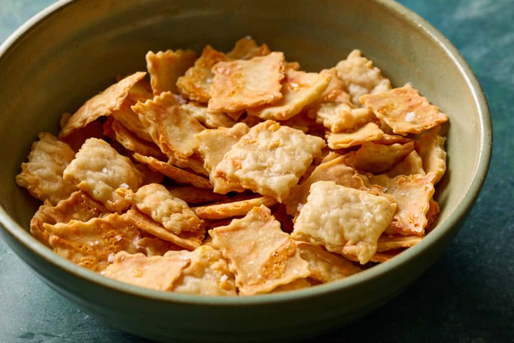 A bowl filled with sourdough discard crackers