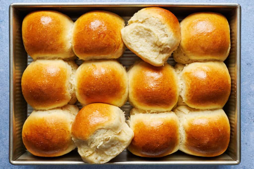 overhead view of dinner rolls made from sourdough discard hot out of the oven