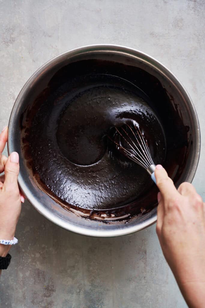 Stirring cupcake batter that's black from black cocoa powder