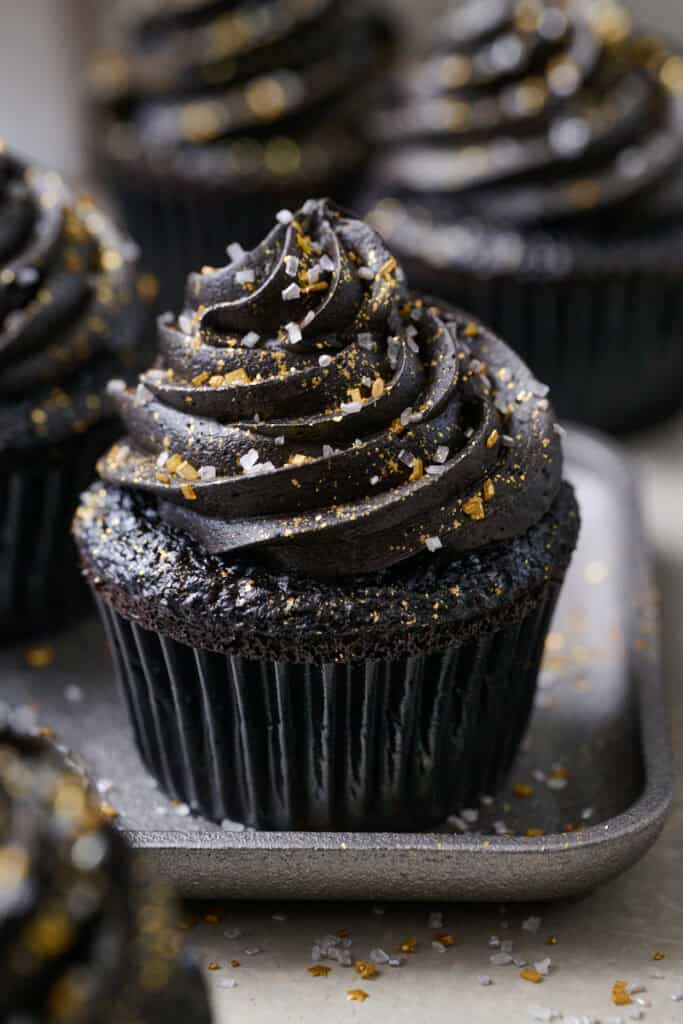 a black velvet cupcake on a plate close up