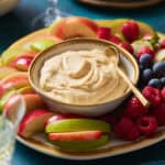 platter of fruit with apples, raspberries, grapes and a creamy four ingredient cheesecake fruit dip