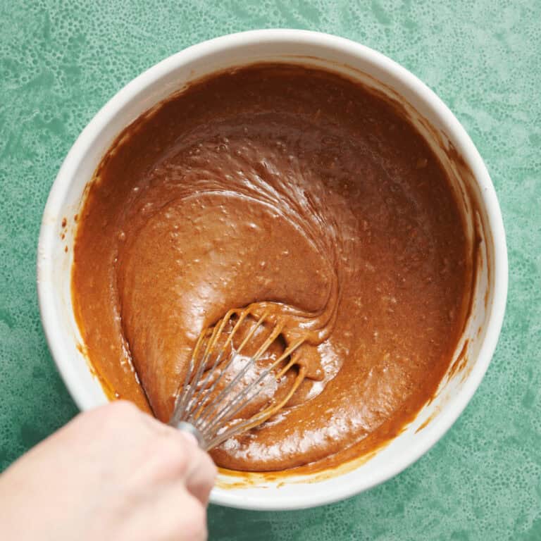 whisking the gingerbread cake batter