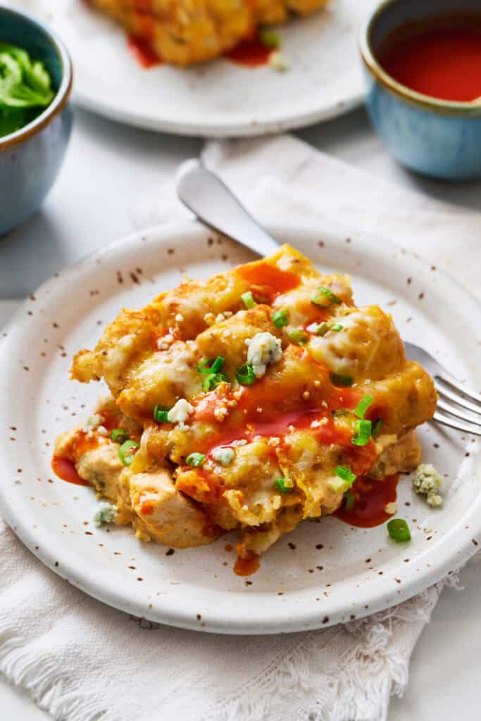 A serving of buffalo chicken tater tot casserole on a plate