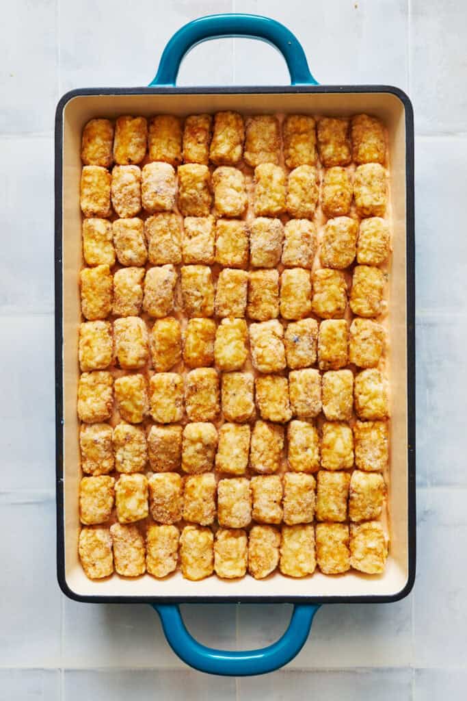 overhead view of a 9 x 13 pan with tater tots layered on top