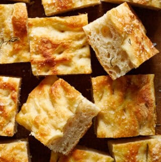 overhead view of slices of sourdough focaccia on a cutting board