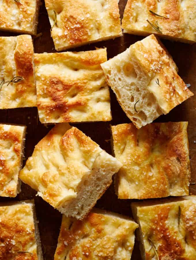 overhead view of slices of sourdough focaccia on a cutting board