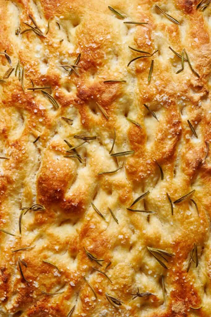 closeup view of sourdough discard focaccia fresh from the oven with rosemary and salt on top