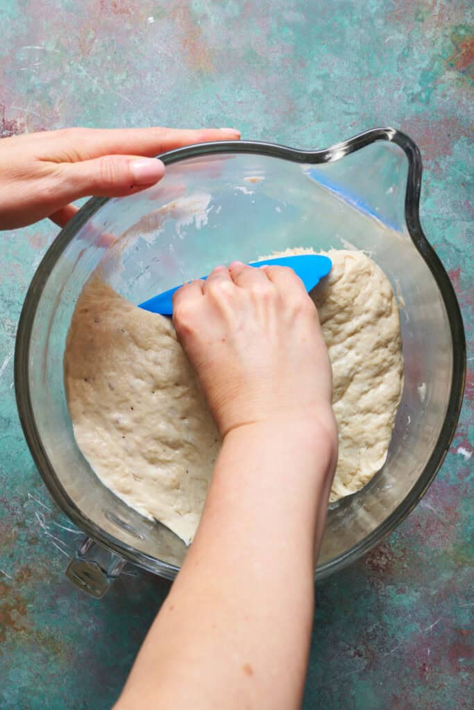 pulling the dough out of the bowl