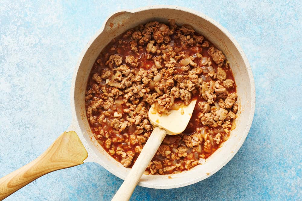 ground chicken sloppy joes being made with sauce before it's thickened