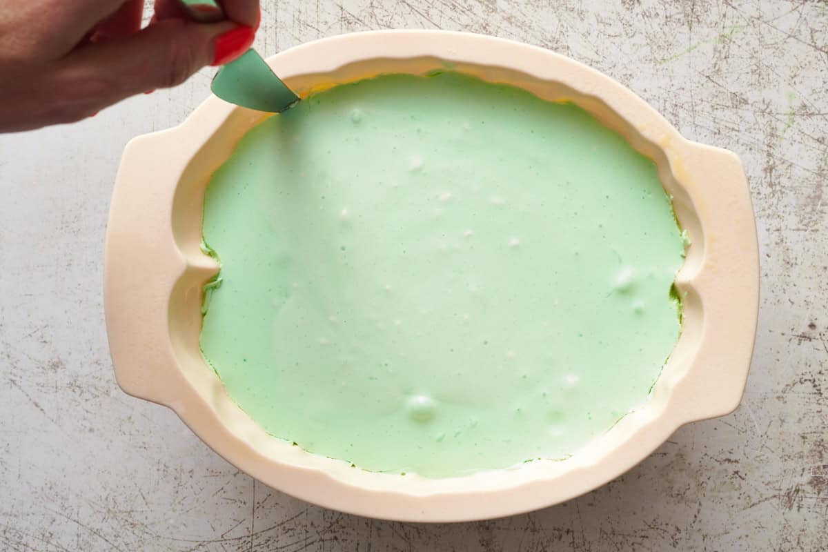 green jello and cool whip solidified in a silicone mold