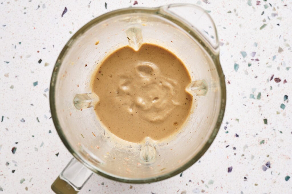 overhead view of blended mushrooms, onions and beef broth with garlic to make the mushroom gravy.