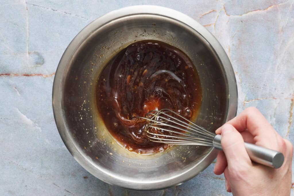 whisking the teriyaki marinade