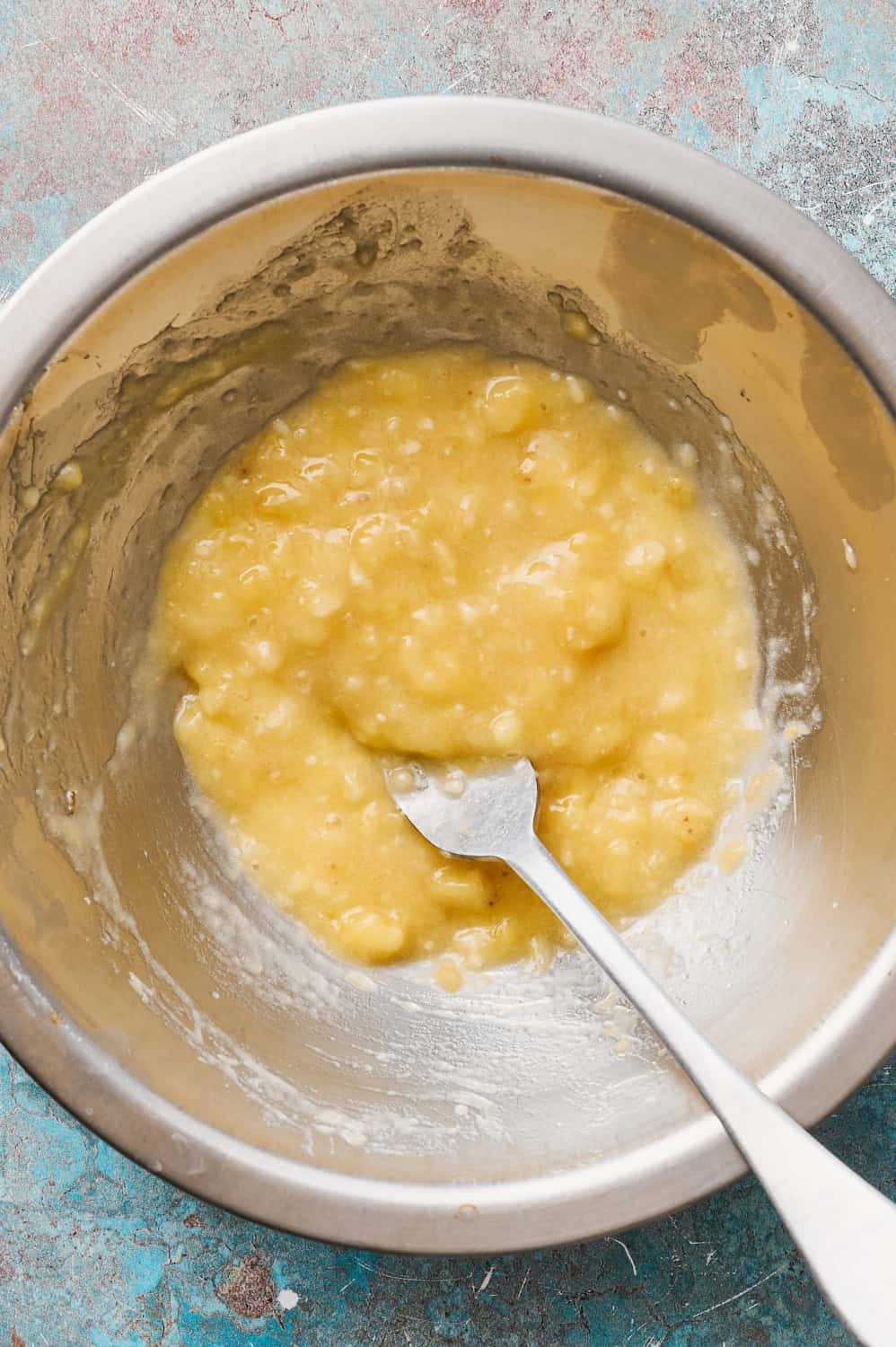 mashed up ripe banana in a bowl