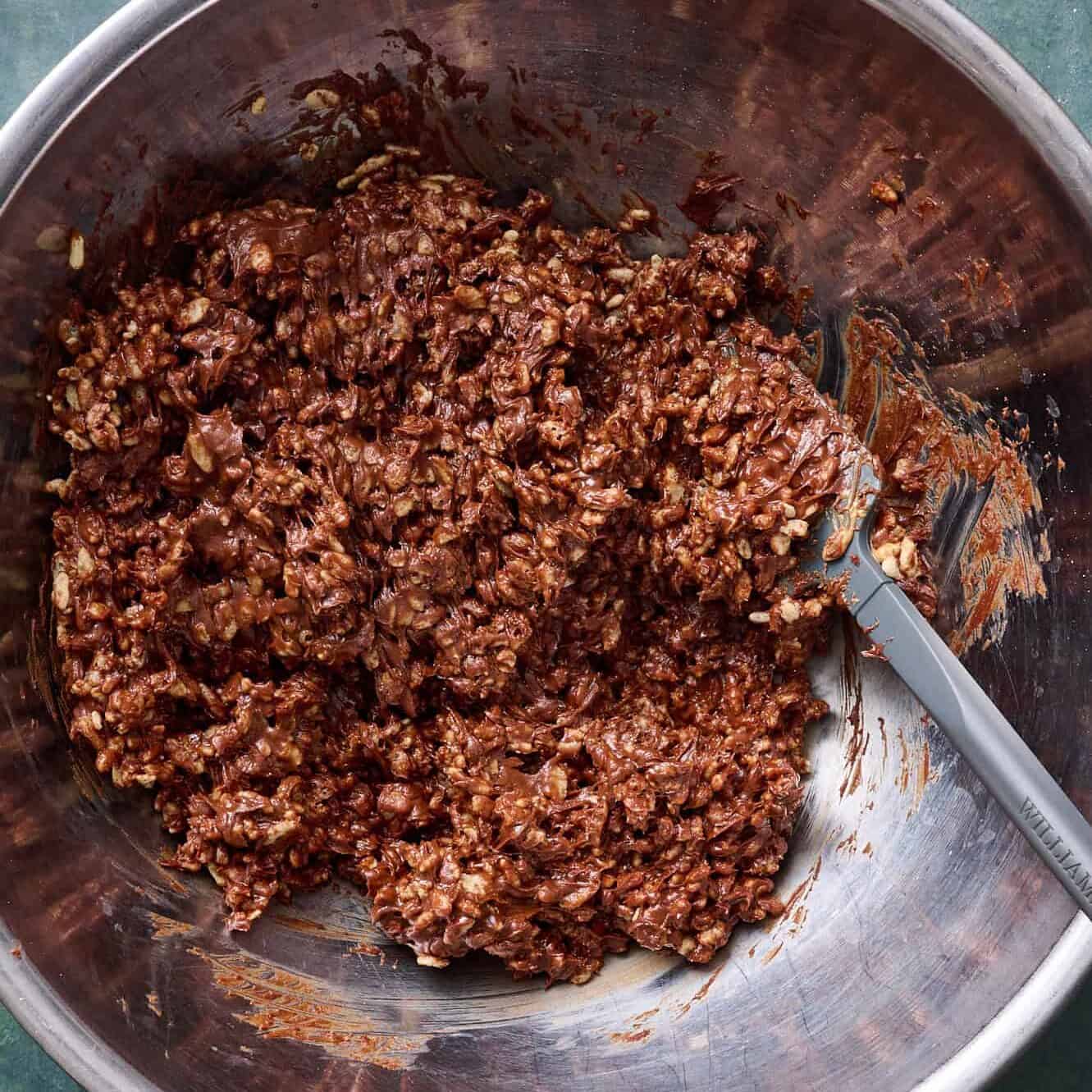 rice krispies mixed with the chocolate mixture ready to be scooped