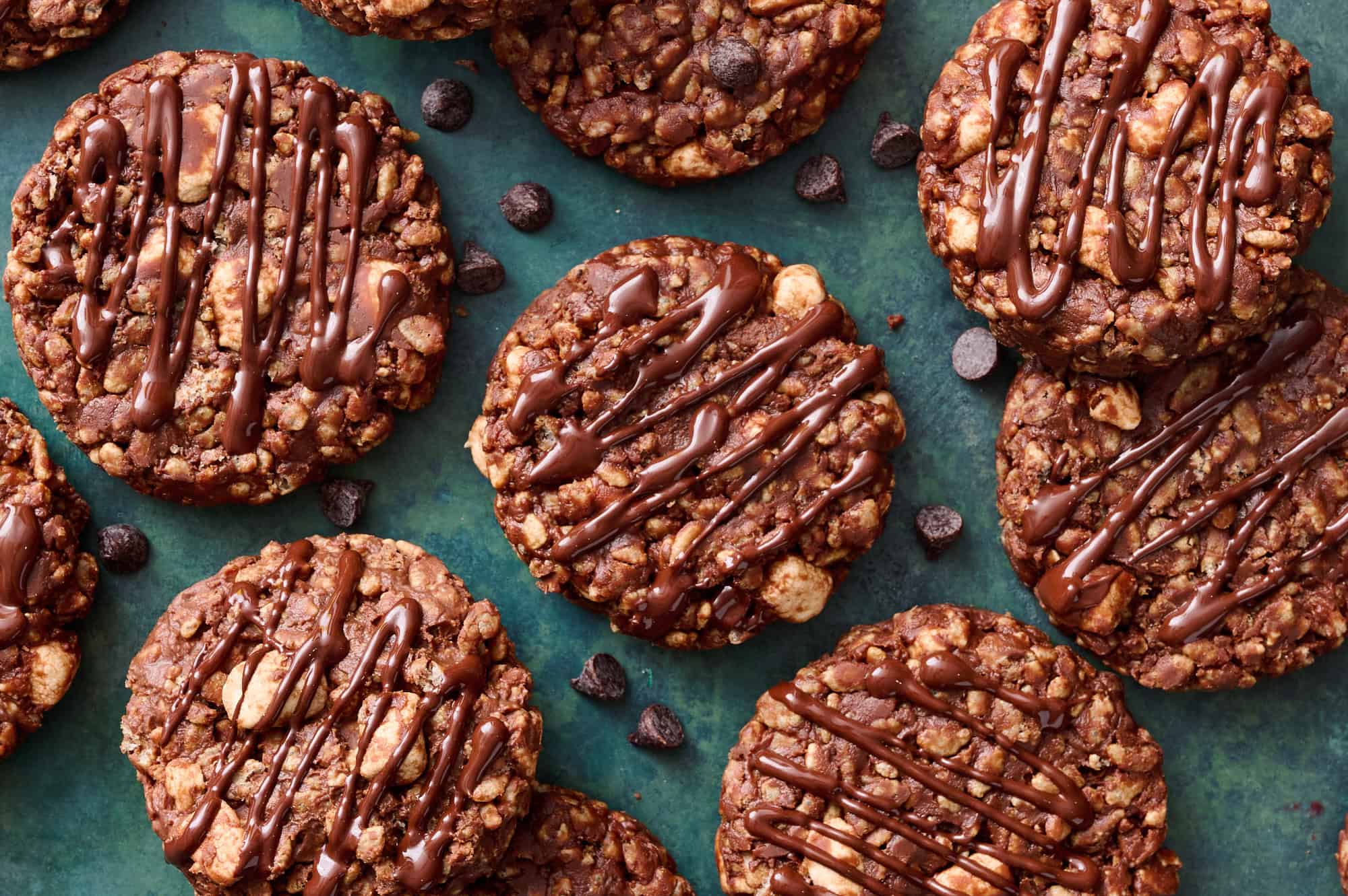 overhead view of finished rice krispie cookies with drizzled chocolate on top