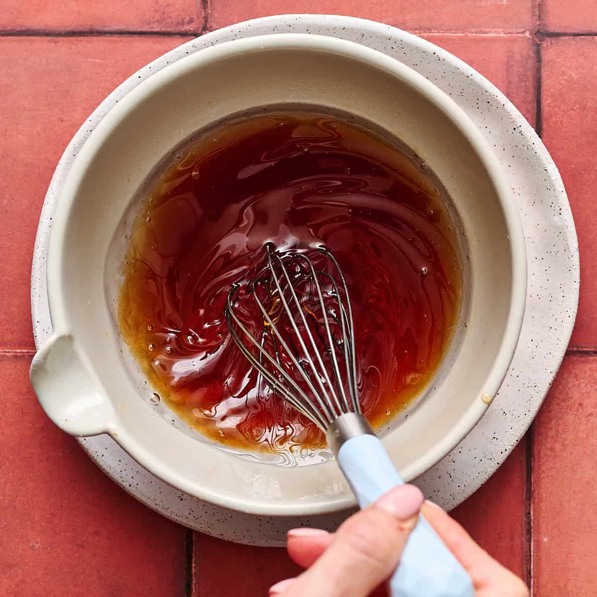 whisking together the wet ingredients in a small bowl